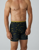 Male model wearing Savage Tacticians black boxer briefs with yellow pencil print and branded waistband