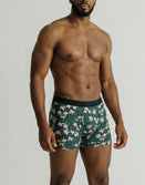 Male model wearing Savage Tacticians floral print green boxer briefs
