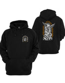 Black Saint Graphic Hoodie by Savage Tacticians. Back print: a winged archangel wearing a helmet with night-vision goggles, wielding an M16 with a bayonet, standing over a defeated foe, framed by Destroy All That Which Is Evil So That Which Is Good May Flourish in orange; small matching Savage Tacticians logo on the left chest