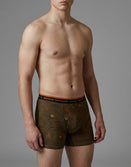 Male model wearing Savage Tacticians camo boxer briefs with topographic pattern