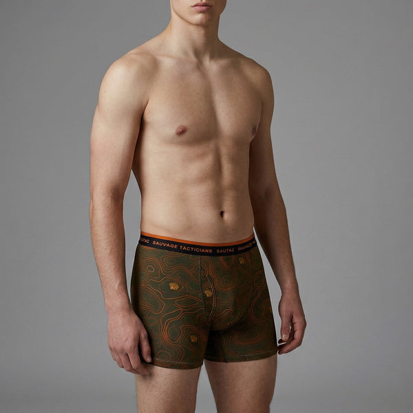 Male model wearing Savage Tacticians camo boxer briefs with topographic pattern