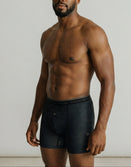 Male model wearing Savage Tacticians black boxer briefs with topographic pattern