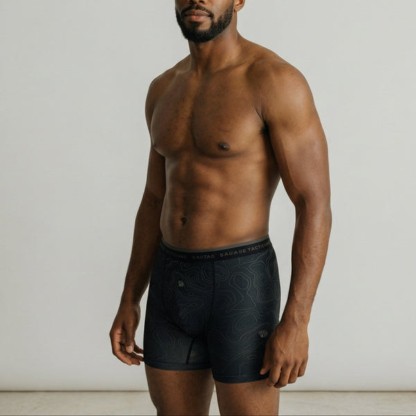 Male model wearing Savage Tacticians black boxer briefs with topographic pattern