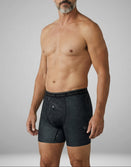 Man wearing Savage Tacticians black boxer briefs with contour line pattern