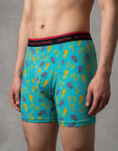 Man wearing Savage Tacticians boxer briefs with pineapple and palm tree print