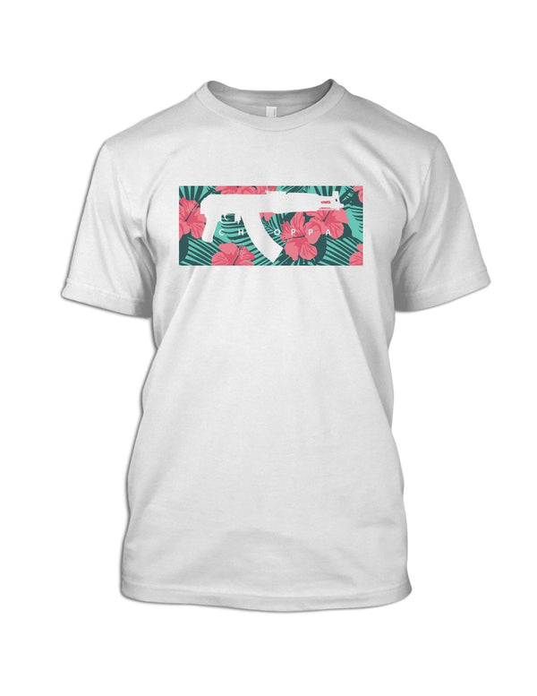 Savage Tacticians White tee featuring a black silhouette of a compact AK-style rifle over a tropical teal palm frond and pink hibiscus print, text "Tropo Choppa."