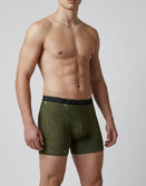 Male model wears olive green Savage Tacticians boxer briefs with topographic pattern