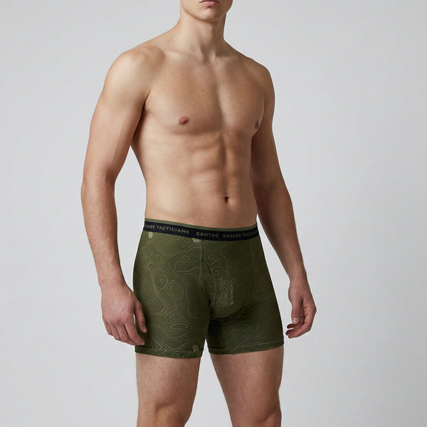 Male model wears olive green Savage Tacticians boxer briefs with topographic pattern